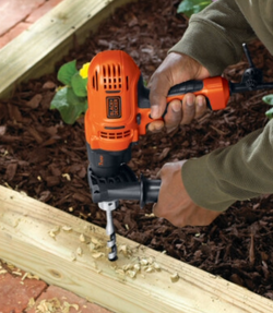 Black+Decker hammer drill on wood