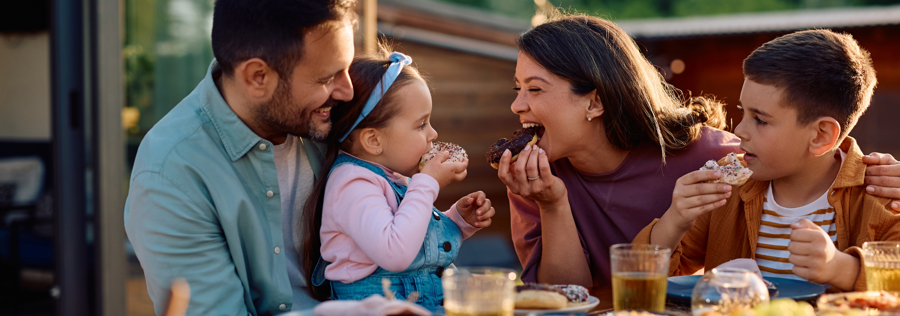 Family eating breakfast on patio