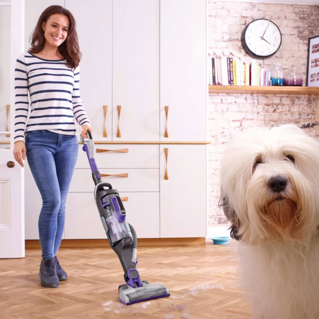 BLACK+DECKER powerseries cordless pet vacuum with dog in foreground