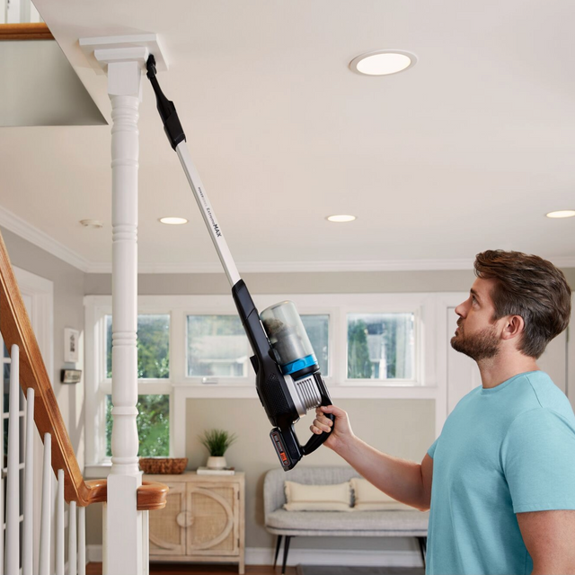 man using POWERSERIES stick vacuum in handheld mode