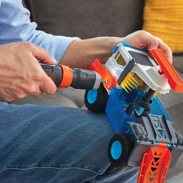 Cordless screwdriver being used on a toy truck