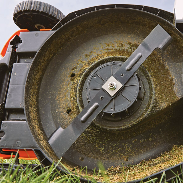 lawn mower replacement blade near cut grass