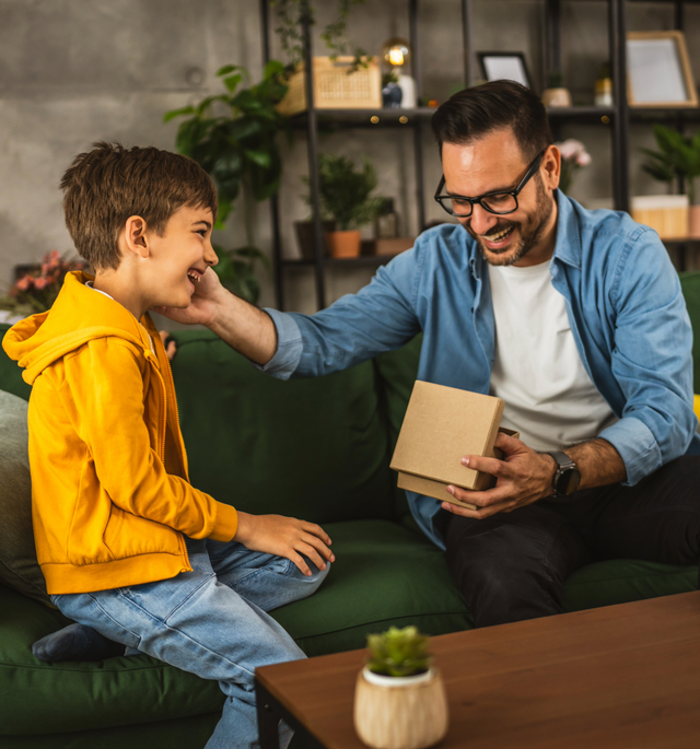 man receiving a gift from a boy