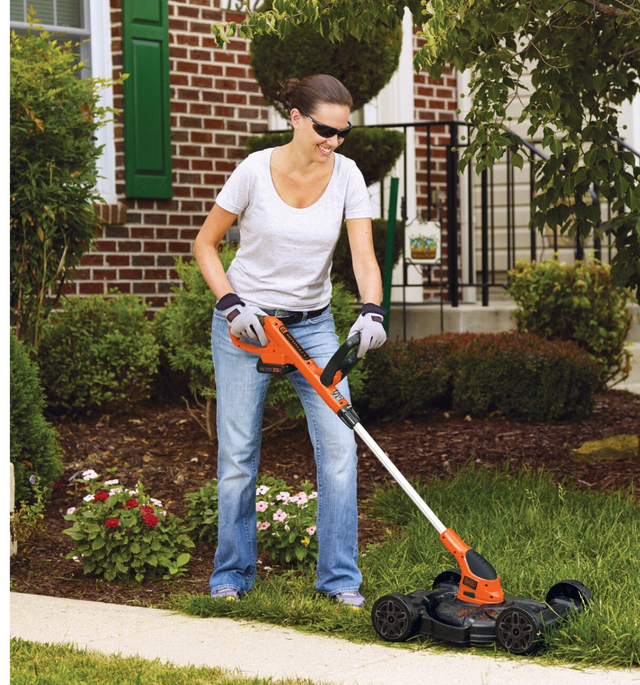 Woman using string trimmer