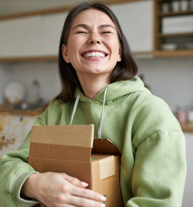 woman unboxing a gift