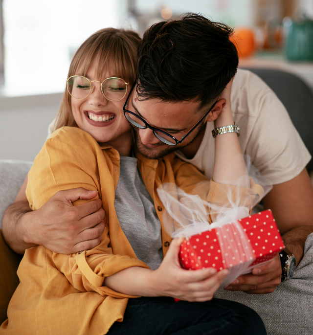 man giving a woman a gift