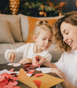 Mom and daughter making valentine's day crafts