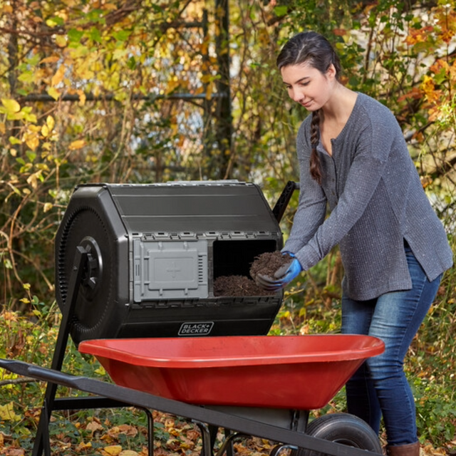 Woman using BLACK+DECKER composter